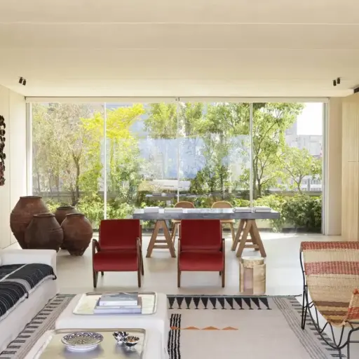 Interior Design Ideas For A Living Room With Large Windows And With Cream Walls And With A White Sofa And With Red Armchairs And With A Textured Rug And With A Bench