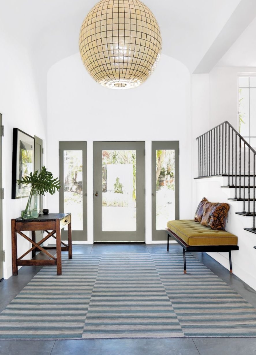 Entryway Design With A Striped Rug