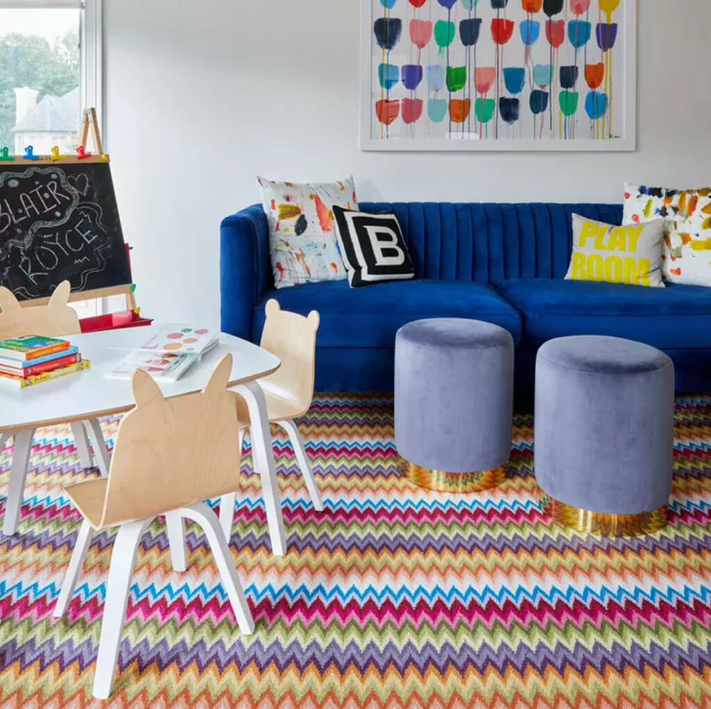 Kids Room With Colorful Rug And Blue Sofa
