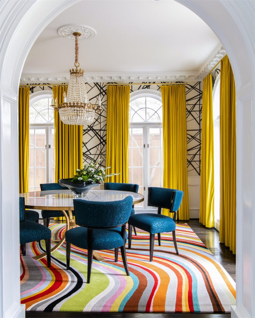 Dining Room With A Colorful Rug