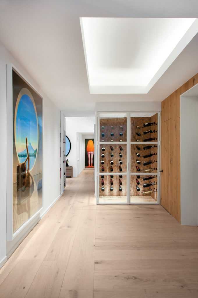 Hallway Adorned With A Wine Celler 