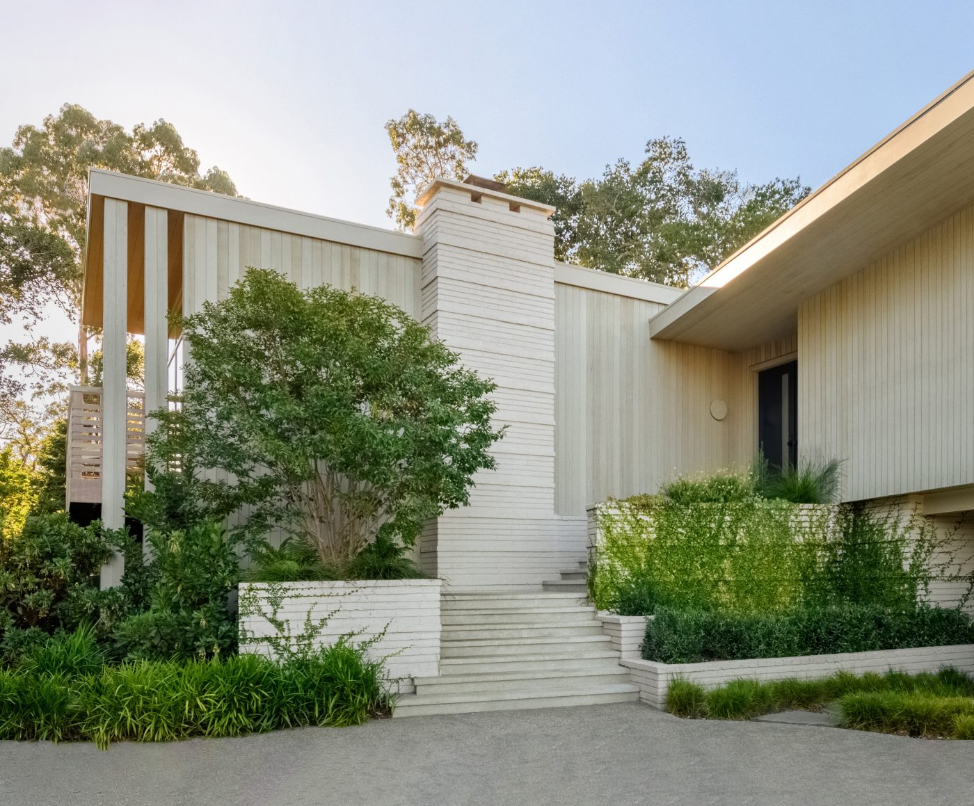 Custom Rugs Bring Personality And Balance To A Modernist Silicon Valley Home. Modern-Style House Nestled In Lush Greenery, Surrounded By Trees And Natural Landscape